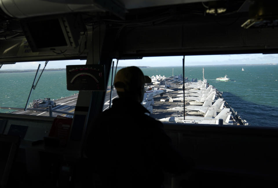 A person on the bridge looks down at F18 jets lined up on the flight deck of the USS Gerald R. Ford, the 'world's largest warship', during a media visit while it is anchored in the Solent during a stopover in Portsmouth on it's maiden deployment. Picture date: Thursday November 17, 2022. (Photo by Andrew Matthews/PA Images via Getty Images)