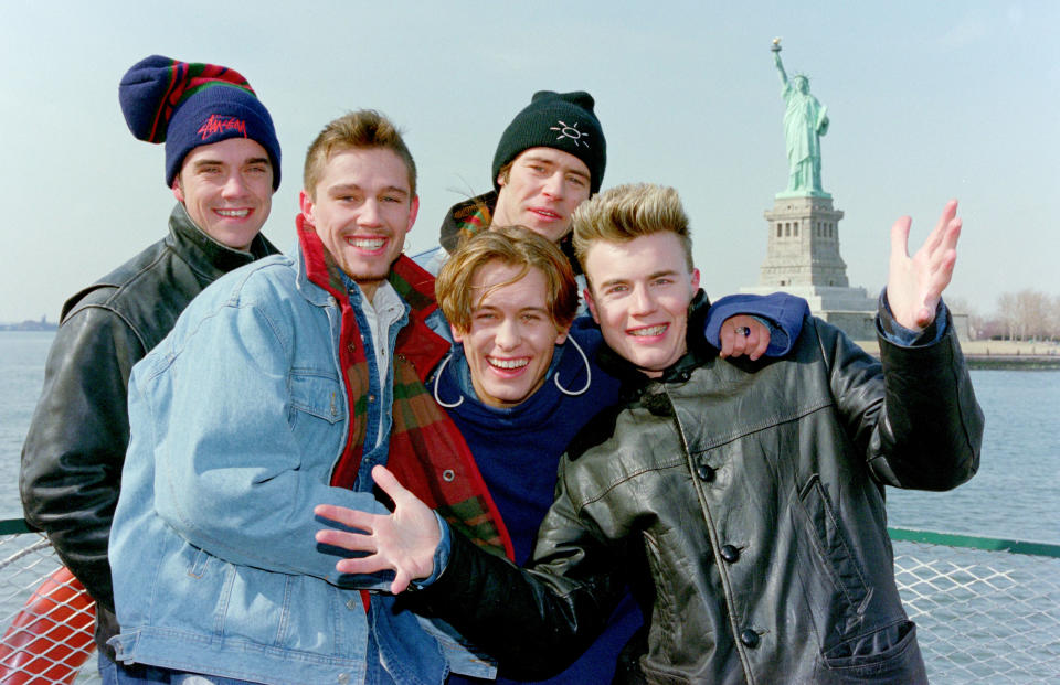 Mark Owen, Howard Donald, Gary Barlow, Robbie Williams and Jason Orange of Take That visit the Statue of Liberty in New York, 1995 (Photo by DaveHogan/Getty Images)