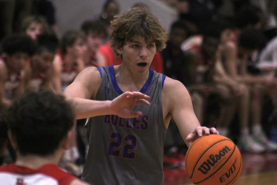 Bolles forward Pierce Shirk (22) directs the offense against Bishop Kenny during a February basketball quarterfinal.