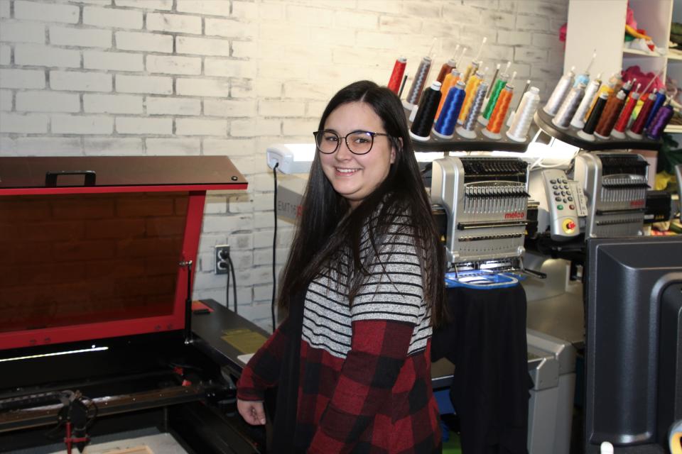 Makaylee Newsome pauses for a moment at Perfect Designs in downtown Carlsbad on Nov. 22, 2022, merchants were preparing for Small Business Saturday.