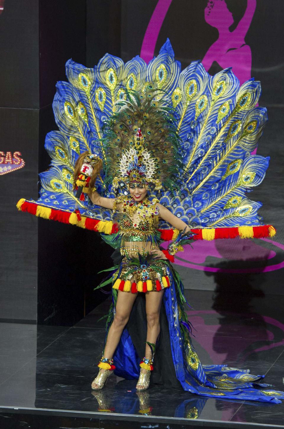 Whulandary, Miss Indonesia 2013, models in the national costume contest for Miss Universe 2013 at Vegas Mall in Moscow