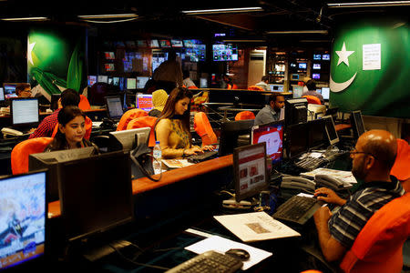 Employees work at the news room of Geo News television channel in Karachi, Pakistan April 11, 2018. Picture taken April 11, 2018. REUTERS/Akhtar Soomro