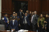 Congress President Jose Williams gives thumbs up after lawmakers verbally voted to remove President Pedro Castillo from office in Lima, Peru, Wednesday, Dec. 7, 2022. Peru's Congress voted to remove Castillo from office Wednesday and replace him with the vice president, shortly after Castillo tried to dissolve the legislature ahead of a scheduled vote to remove him.(AP Photo/Guadalupe Pardo)