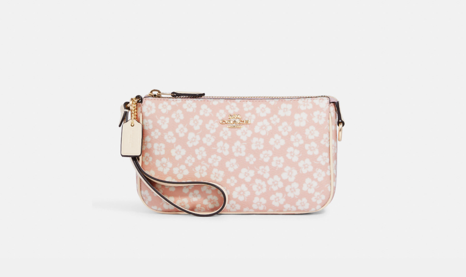 Nolita 19 in graphic ditsy floral print (Photo via Coach Outlet)