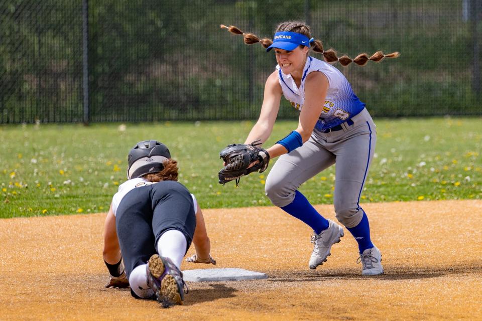 Maine Endwell junior, Kaetlyn L’Amoreaux tries to tag out Ellie DeRosa of Corning Saturday in the STAC Softball championship Game.