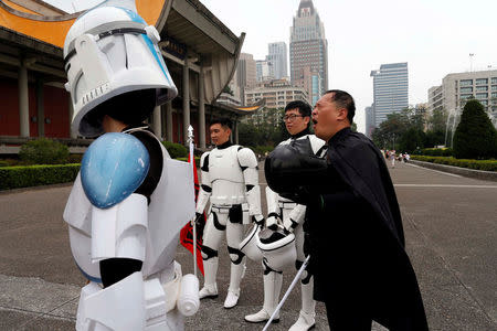 Fans dressed as the characters from "Star Wars" react during Star Wars Day in Taipei, Taiwan May 4, 2017. REUTERS/Tyrone Siu