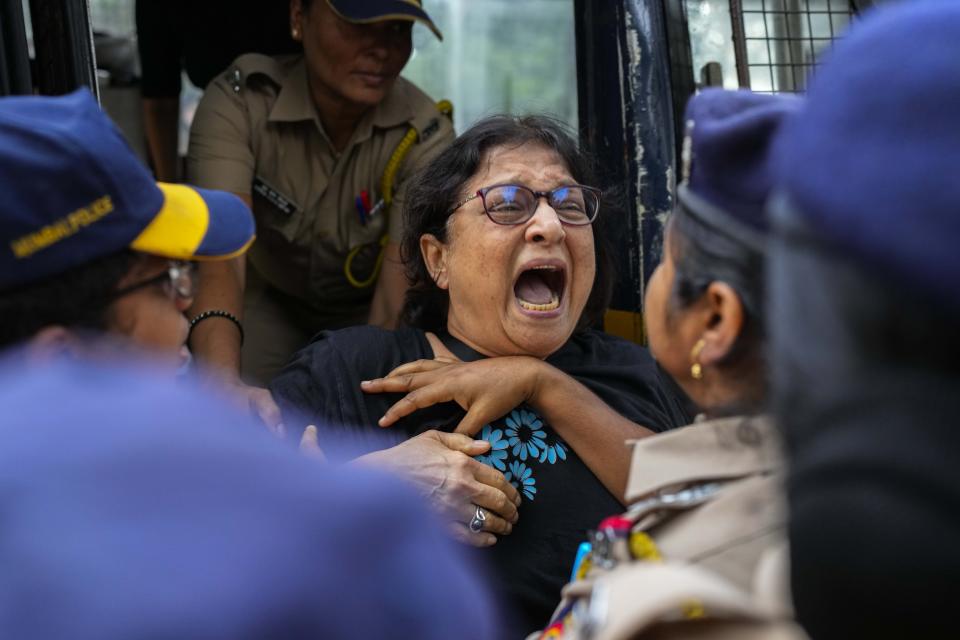 FILE- An activist of India's opposition Congress party protesting against ethnic violence in northeastern Manipur state is detained by police in Mumbai, India, July 31, 2023. For three months, Indian Prime Minister Narendra Modi has been largely silent on ethnic violence that has killed over 150 people in Manipur, a remote state in India’s northeast. That's sparked a no-confidence motion against his government in Parliament, where his party and allies hold a clear majority. (AP Photo/Rafiq Maqbool, File)