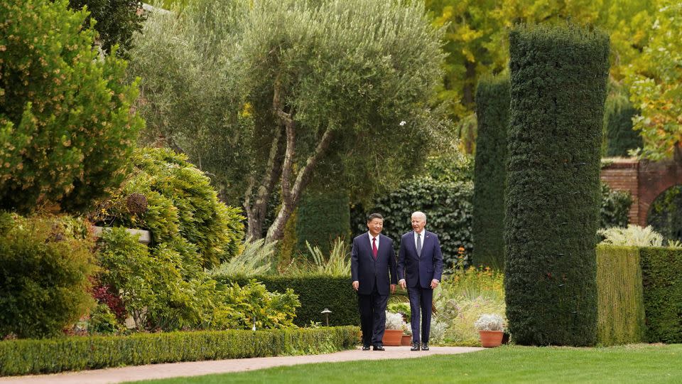 Biden walks with Xi Jinping at the Filoli estate in Woodside, California, in November 2023. - Kevin Lamarque/Reuters/File