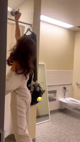 <p>Danielle Jonas Instagram</p> Danielle Jonas throwing ice over husband Kevin in the shower as a prank