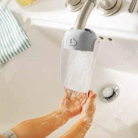 A faucet extender on a sink