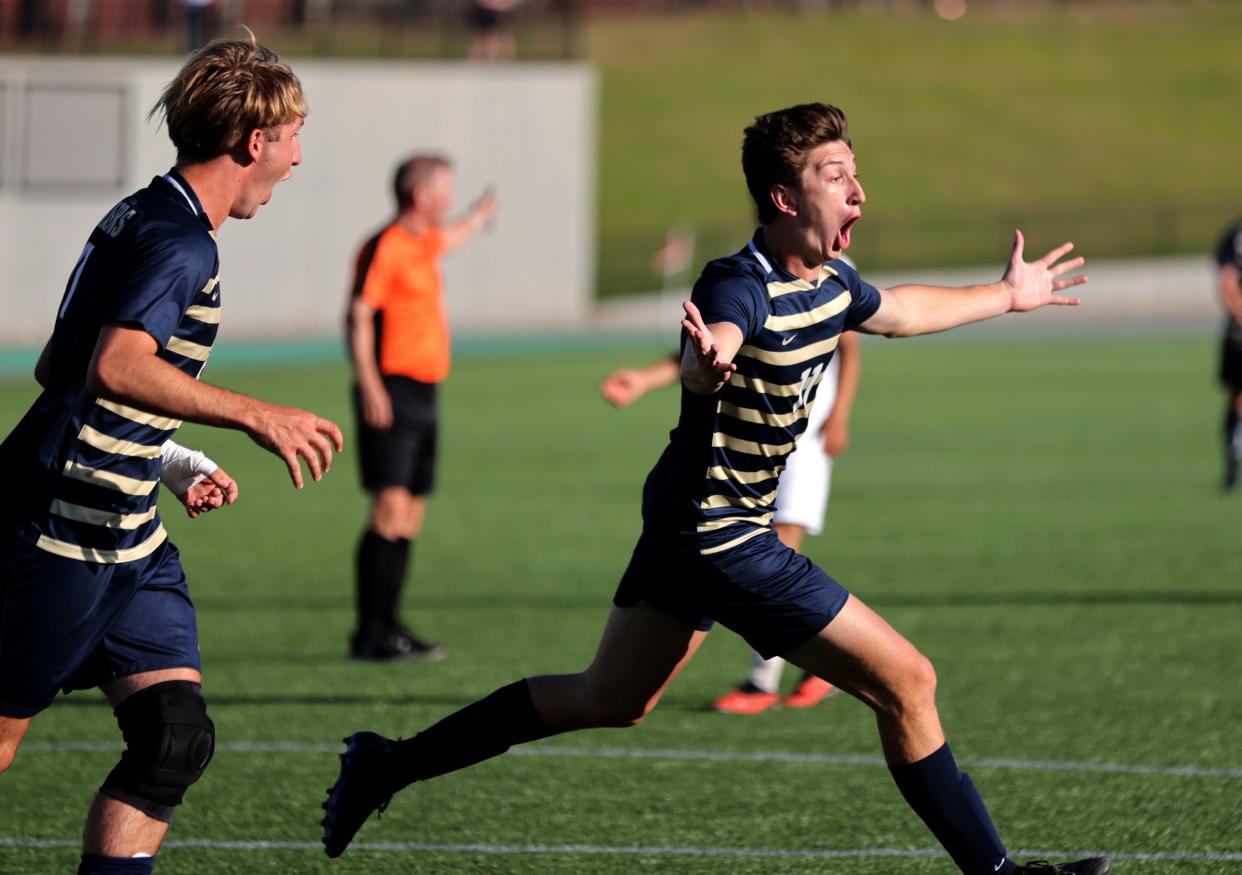 Heritage Hall's celebrates his goal next to Fabian Martinez during the Class 4A state soccer championship game between Clinton and Heritage Hall at Taft Stadium in Oklahoma City, Friday, May, 10, 2024.