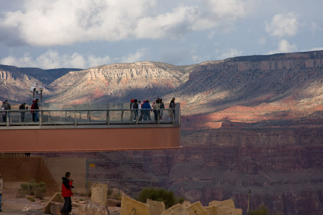 The Grand Canyon Skywalk. Photo: John Wood - The Grand Canyon Skywalk is a horseshoe-shaped cantilevered bridge with a glass base that juts out over the canyon in the Grand Canyon West area. Located at a height of 4,770ft, the views are spellbinding and the canyon’s famous blazing sunrises and sunsets take on an entirely different character here. Note that personal belongings such as cameras are not permitted on to the Skywalk.