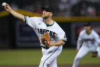 Arizona Diamondbacks starting pitcher Merrill Kelly throws against the Miami Marlins during the first inning of a baseball game, Wednesday, May 10, 2023, in Phoenix. (AP Photo/Matt York)