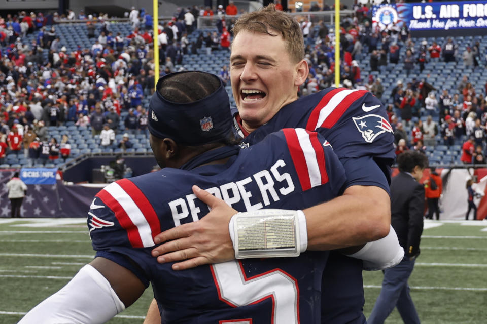 New England Patriots quarterback Mac Jones (10) embraces safety Jabrill Peppers (5) following a 29-25 win against the Buffalo Bills after an NFL football game, Sunday, Oct. 22, 2023, in Foxborough, Mass. (AP Photo/Winslow Townson)