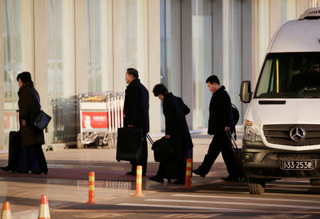 North Korean officials arrive at the international airport as they leave for Washington from Beijing, China January 17, 2019. REUTERS/Jason Lee