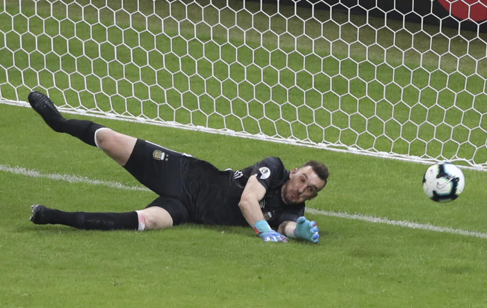 Argentina's goalkeeper Franco Armani makes a save during a Copa America Group B soccer match against Paraguay at Mineirao stadium in Belo Horizonte, Brazil, Wednesday, June 19, 2019. (AP Photo/Ricardo Mazalan)