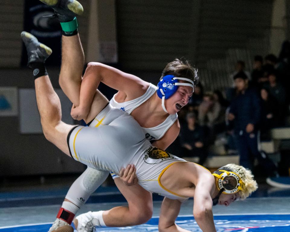 Serrano's Alex Alfonso battles with  Logan Alawneh in the 160-pound championship match at the 15th annual Adrian Amaral Scholarship Invitational on Saturday, Jan. 7, 2023.