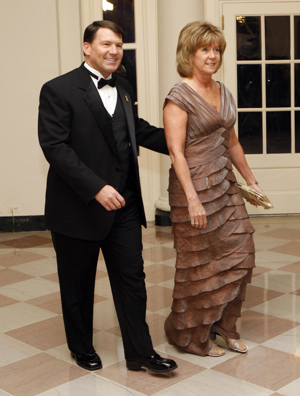 FILE - In this Feb. 22, 2009, file photo, South Dakota Gov. Mike Rounds, left, and his wife, Jean, arrive at the White House to attend a dinner hosted by President Barack Obama, in Washington. Jean Rounds, the wife of Republican Sen. Mike Rounds of South Dakota, died Tuesday, Nov. 2, 2021. She was 65. (AP Photo/Pablo Martinez Monsivais, File)