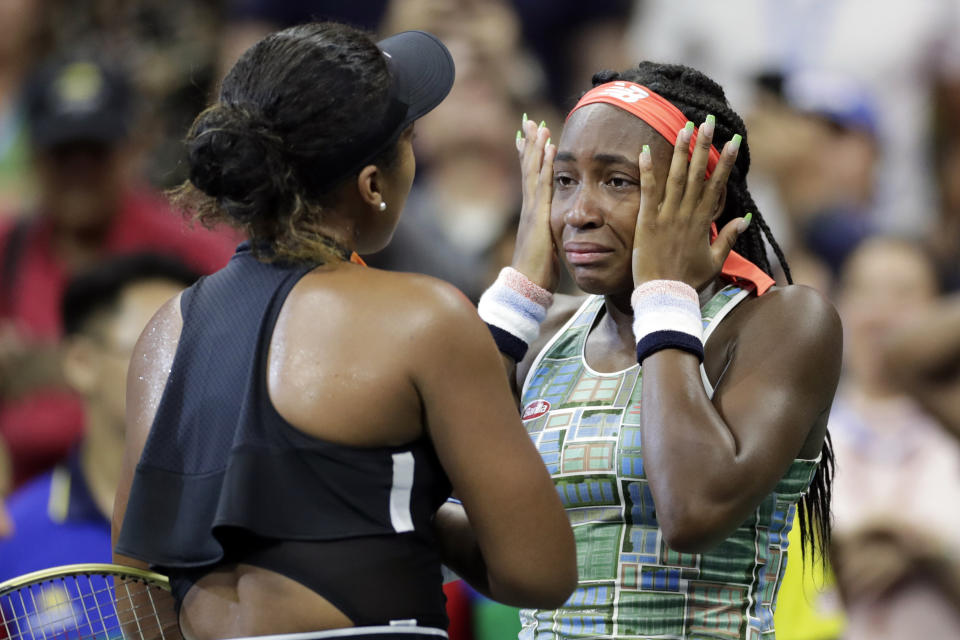 Coco Gauff wipes away tears while talking to Naomi Osaka, of Japan, after Osaka defeated Gauff during the third round of the U.S. Open tennis tournament Saturday, Aug. 31, 2019, in New York. (AP Photo/Adam Hunger)