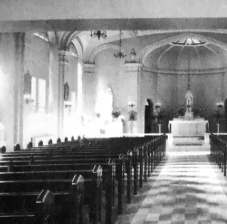 Hall of the Divine Child's chapel is shown in 1919. Today, the chapel is used as a community room/dining room at Norman Towers. This photo shows previous chandeliers in the space.