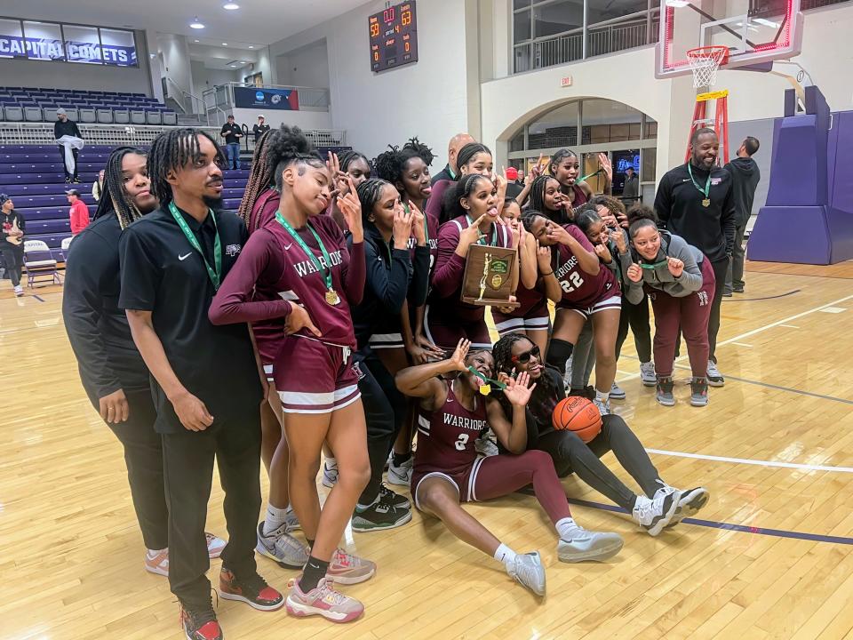 Harvest Prep celebrates its 63-59 win over Mechanicsburg in a Division III district final Thursday at Capital.