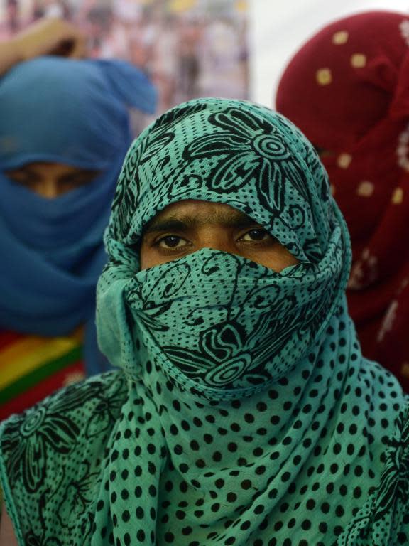 A villager looks on during a protestin New Delhi on April 22, 2014 against the rape of a lower caste Dalit in Haryana state