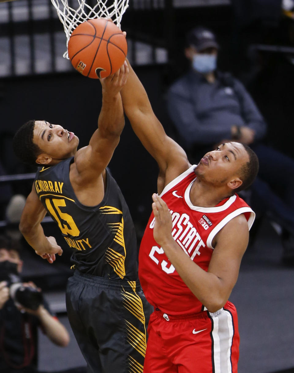 Iowa forward Keegan Murray (15) and Ohio State forward Zed Key (23) grab for a rebound in the first half of an NCAA college basketball game in Iowa City, Iowa, Thursday, Feb. 4, 2021. (Rebecca F. Miller/The Gazette via AP)