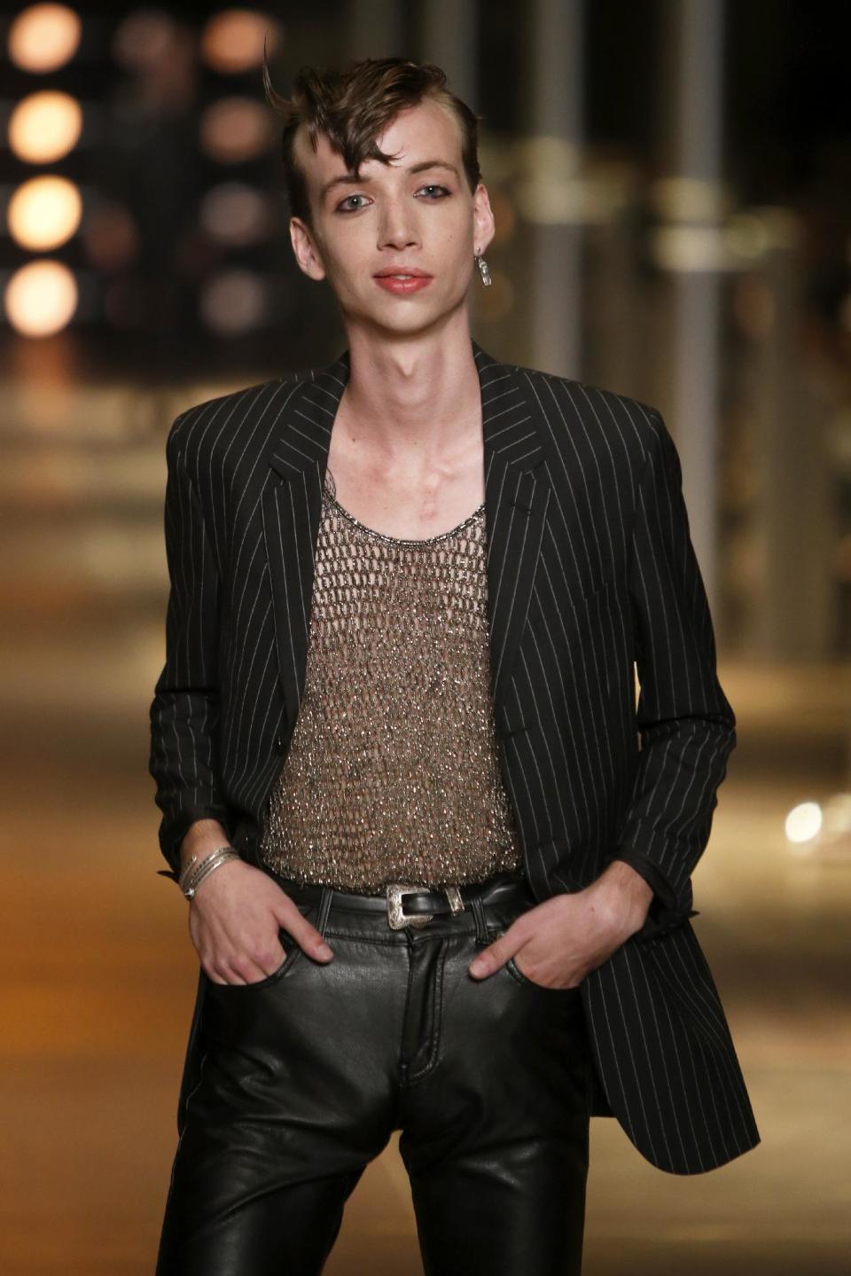 A model presents a creation as part of Yves Saint Laurent's men's fashion Spring-Summer 2014 collection, presented Sunday, June 30, 2013 in Paris. (AP Photo/Francois Mori)