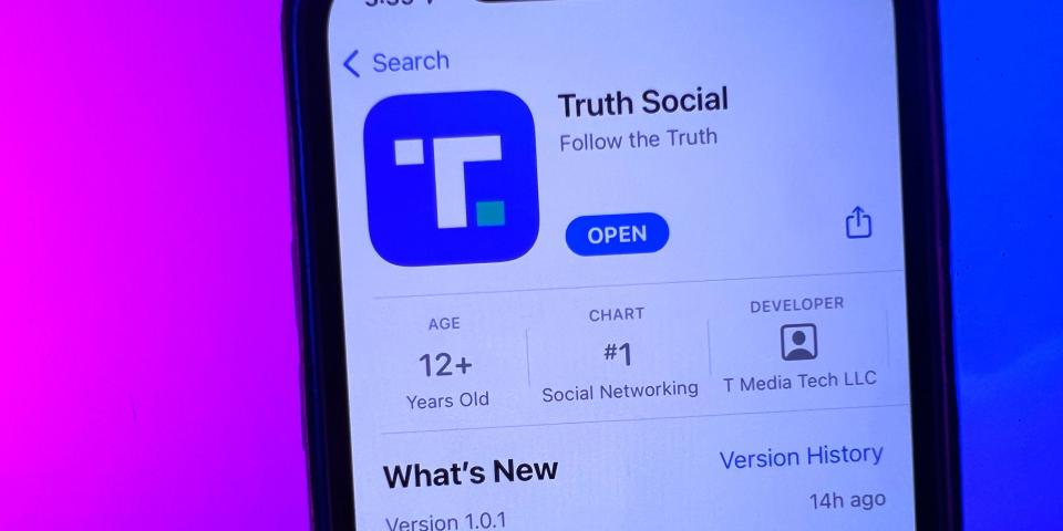 A phone displaying Donald Trump's Truth Social app in the Apple App Store.