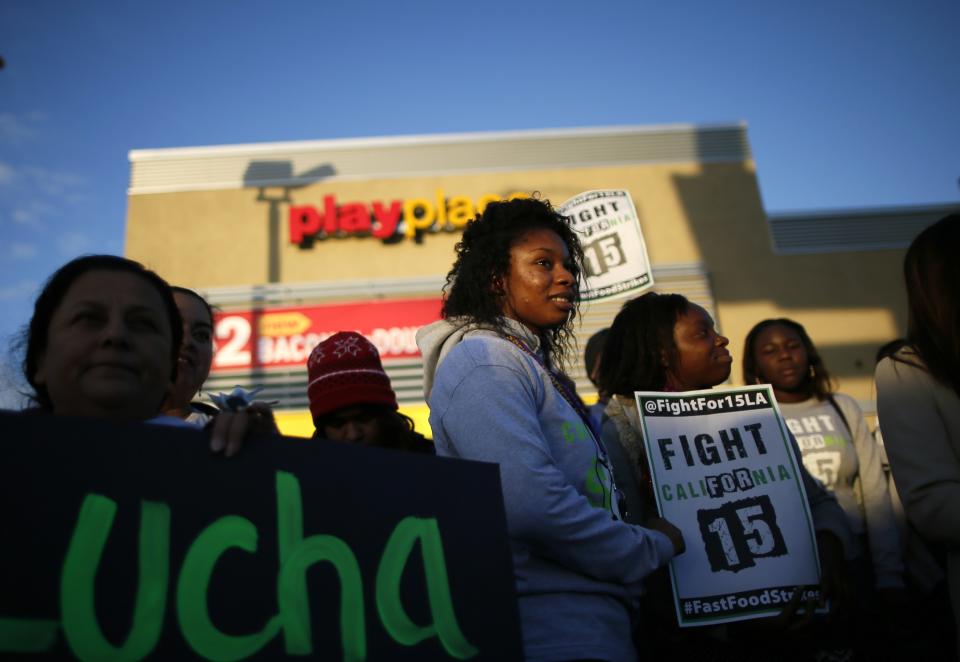 Protesters gather outside McDonald's in Los Angeles, California, December 5, 2013. Organizers say fast food workers will strike in 100 U.S. cities, and there will be protests in 100 more, to fight for $15 an hour wages and the right to form a union. (REUTERS/Lucy Nicholson)