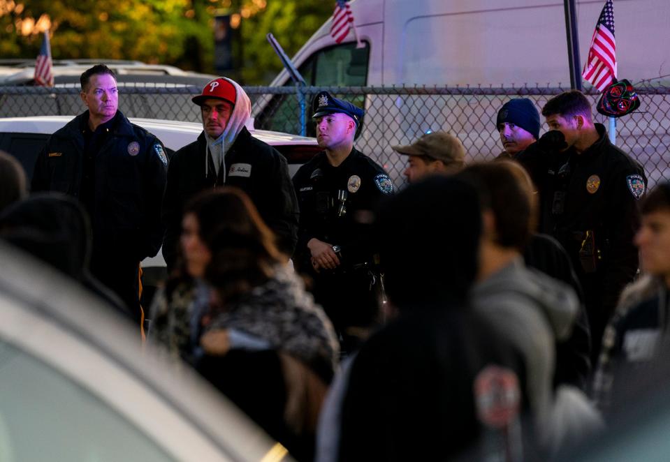 Members of Bensalem police Department stand at the back of the vigil for Peter Romano, the 14 year-old who was fatally shot on Halloween, at 2636 Bristol Pike in Bensalem on Thursday, Nov. 2, 2023.

[Daniella Heminghaus | Bucks County Courier Times]