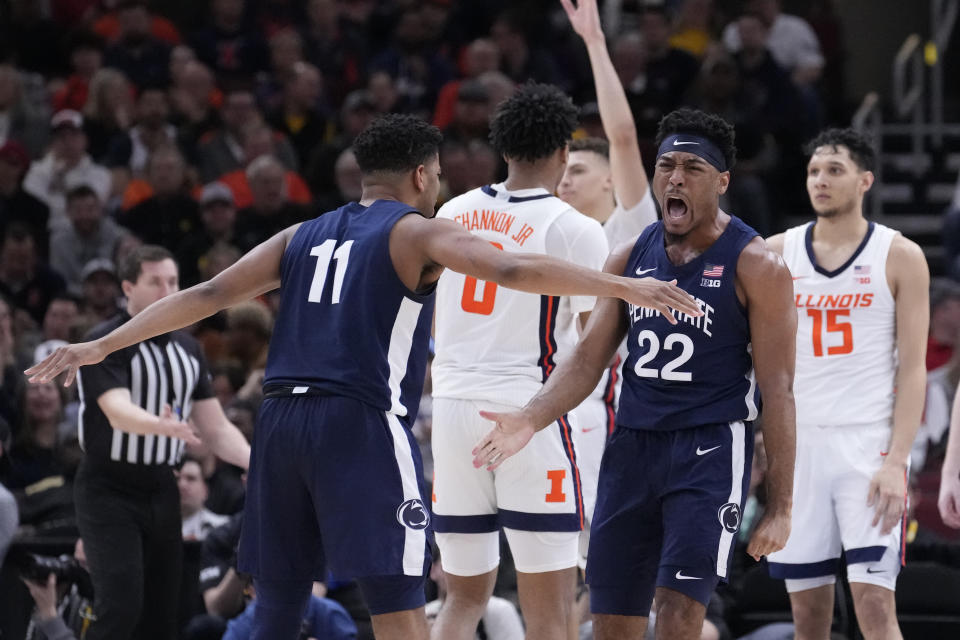 Penn State's Jalen Pickett (22) celebrates with Camren Wynter after scoring and getting fouled during the second half of an NCAA college basketball game against Illinois at the Big Ten men's tournament, Thursday, March 9, 2023, in Chicago. Penn State won 79-76. (AP Photo/Charles Rex Arbogast)