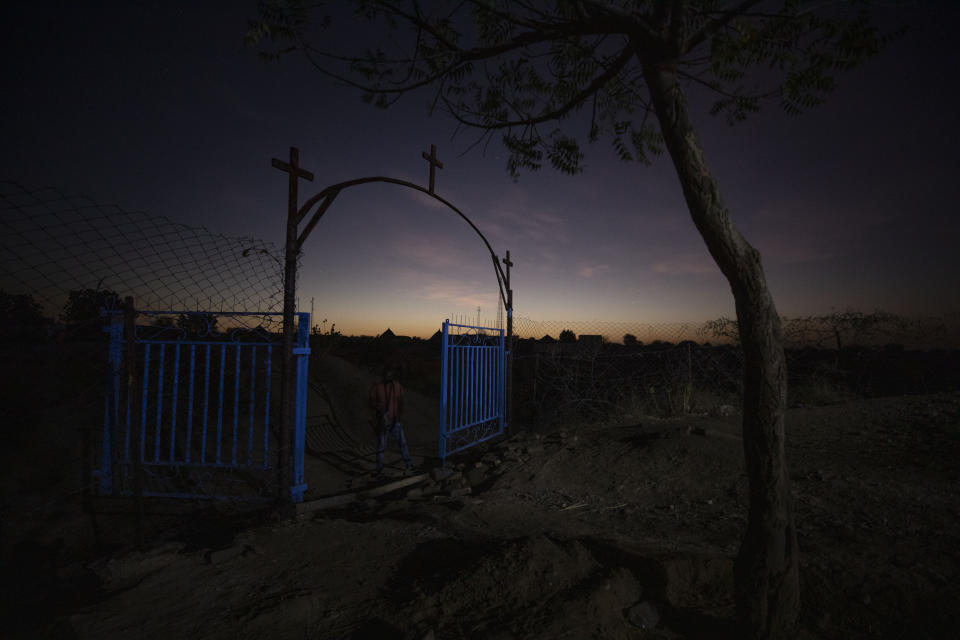 A gate stands open at the church where Tigrayan refugee Abraha Kinfe Gebremariam, 40, prays in Hamdayet, eastern Sudan, near the border with Ethiopia, on March 21, 2021. More than 62,000 refugees from Ethiopia’s embattled Tigray region are in Sudan. (AP Photo/Nariman El-Mofty)