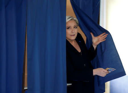 Marine Le Pen, French National Front (FN) political party leader and candidate for French 2017 presidential election, leaves a polling booth as she votes in the first round of 2017 French presidential election at a polling station in Henin-Beaumont. REUTERS/Pascal Rossignol