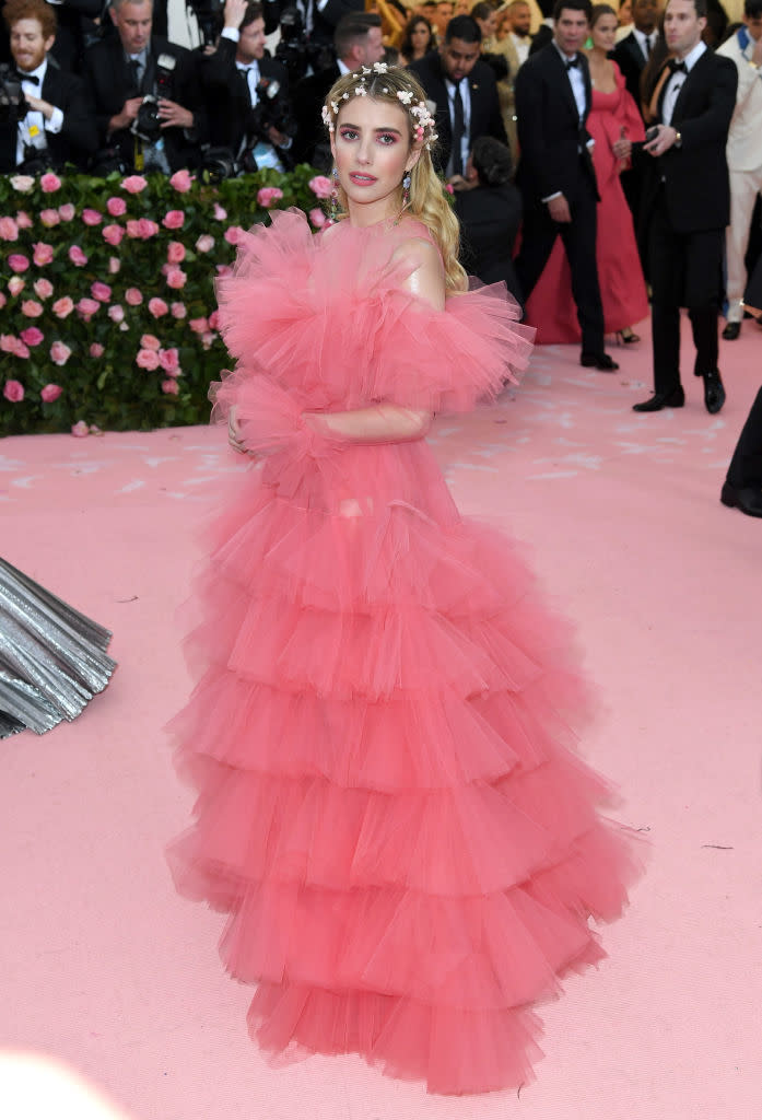 Woman in a layered tulle gown at an event