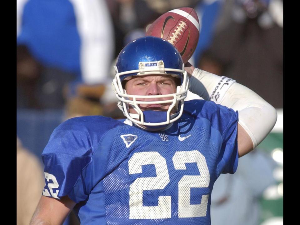 Jared Lorenzen prepares to pass as University of Kentucky quarterback, photo on black