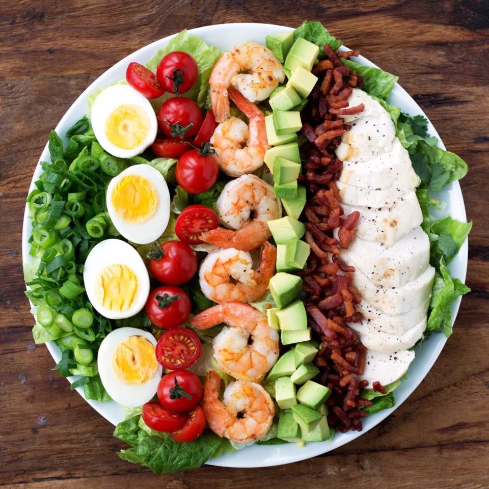 <strong>Get the <a href="http://kitscoastal.com/coastal-cobb-salad/" target="_blank" rel="noopener noreferrer">Coastal Cobb Salad With Creamy Cilantro Lemon Dressing</a> recipe from Kit&rsquo;s Coastal.</strong>