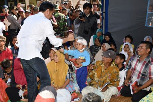 Indonesian President Joko Widodo visits quake-affected people at a shelter in Lombok