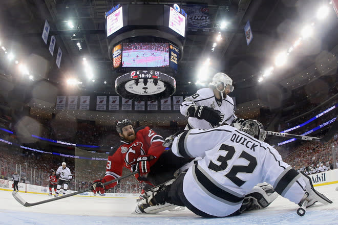   David Clarkson #23 Of The New Jersey Devils Loses His Balance In Front Of Jonathan Quick #32 And Drew Doughty #8 Of  Getty Images