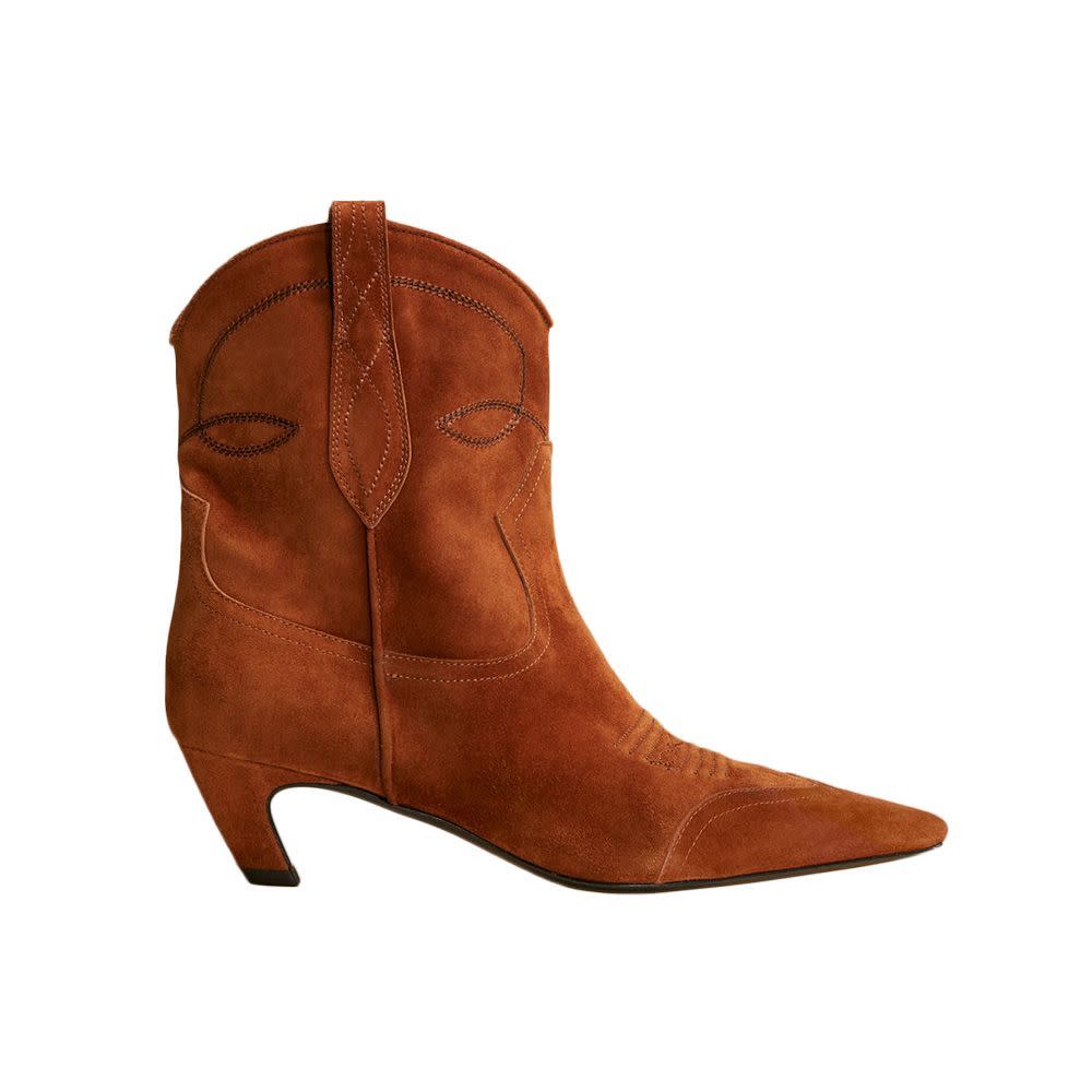 <p><a href="https://go.redirectingat.com?id=74968X1596630&url=https%3A%2F%2Fkhaite.com%2Fproducts%2Fdallas-ankle-boot-in-caramel%3F_pos%3D2%26_sid%3D8507bd687%26_ss%3Dr%26variant%3D39307891343423&sref=https%3A%2F%2F" rel="nofollow noopener" target="_blank" data-ylk="slk:Shop Now;elm:context_link;itc:0;sec:content-canvas" class="link rapid-noclick-resp">Shop Now</a></p><p>Dallas Ankle Boot</p><p>khaite.com</p><p>$1200.00</p>