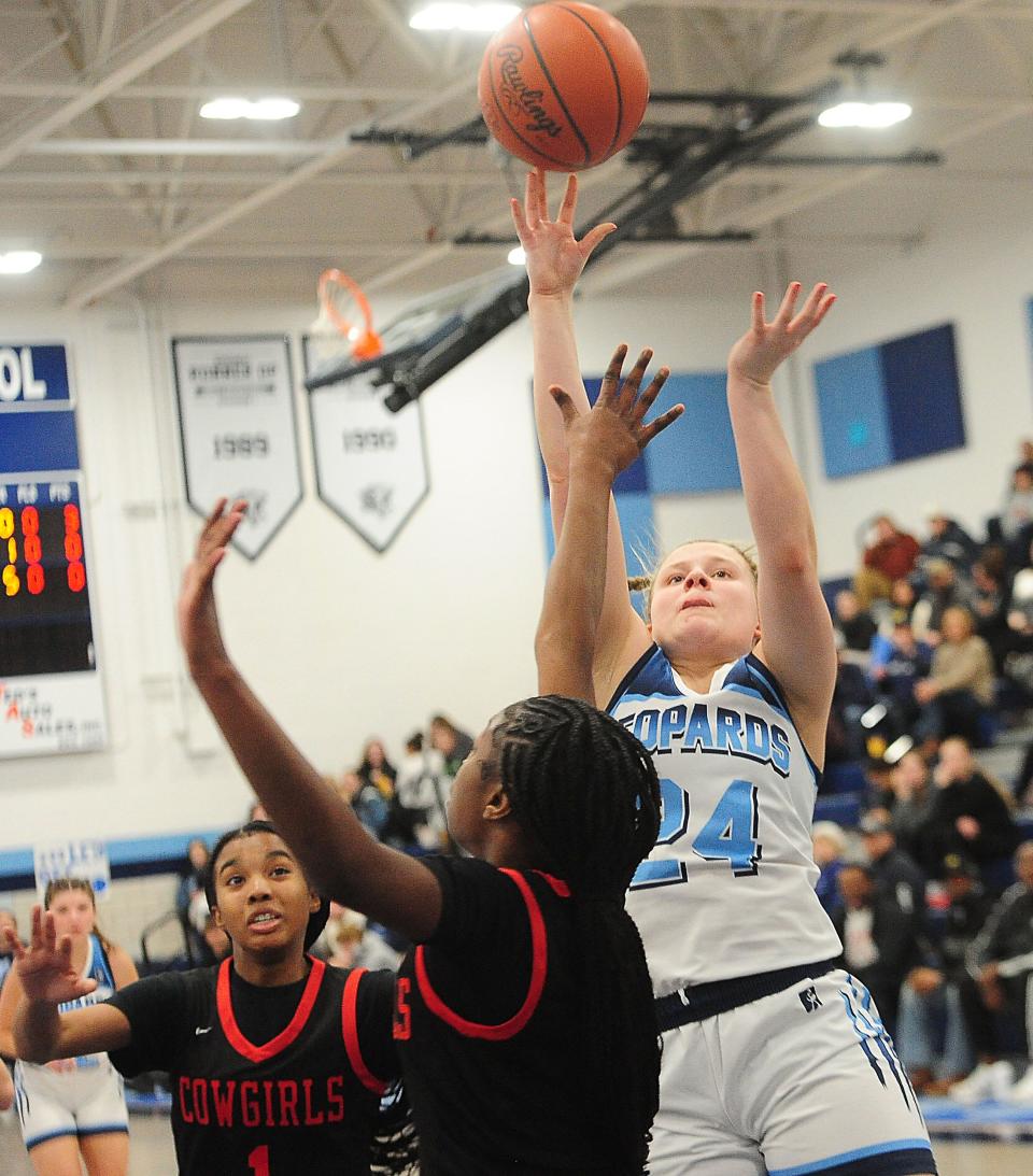 Louisville's Brooke Haren puts up a shot against Chaney in a Division I sectional final, Thursday Feb. 22, 2024.
