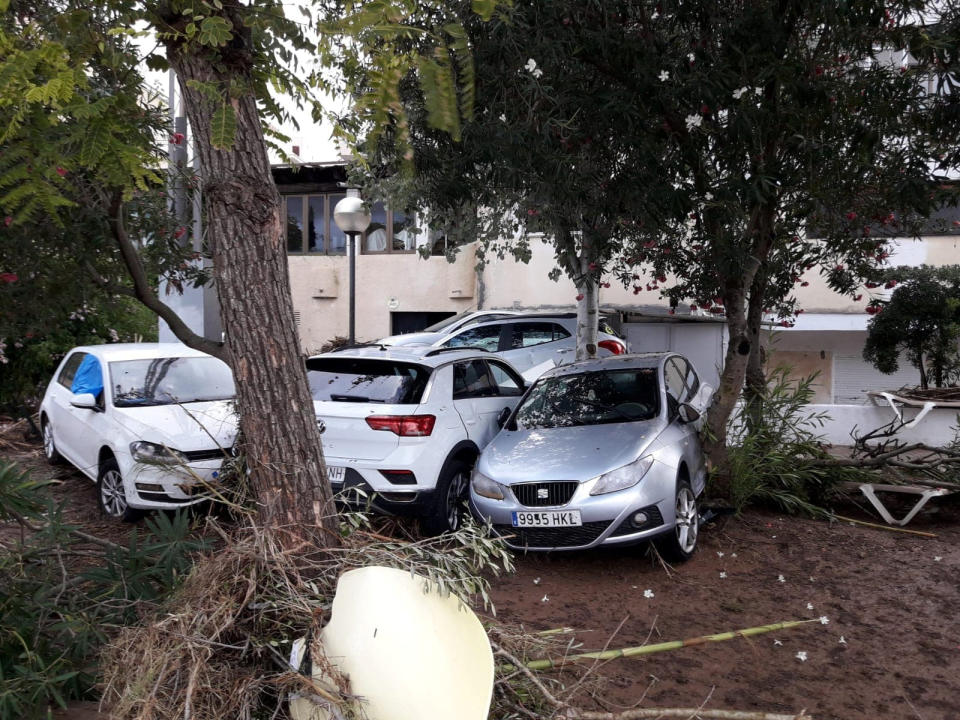 Damaged cars are seen after the storm on the island (Joan Camacho via Reuters)