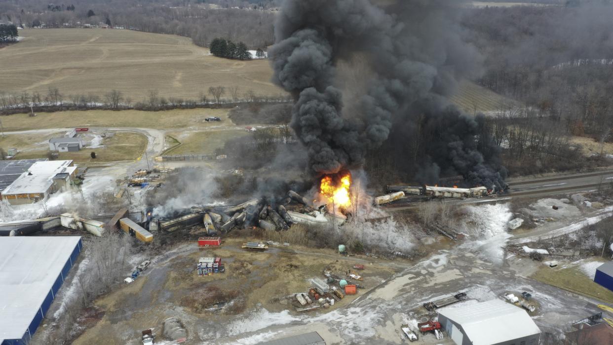 This photo taken with a drone shows portions of a Norfolk and Southern freight train that derailed Friday night in East Palestine, Ohio are still on fire at mid-day Saturday, Feb. 4, 2023. (AP Photo/Gene J. Puskar)