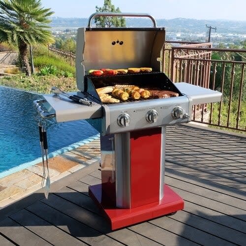 Grill open near pool with food cooking