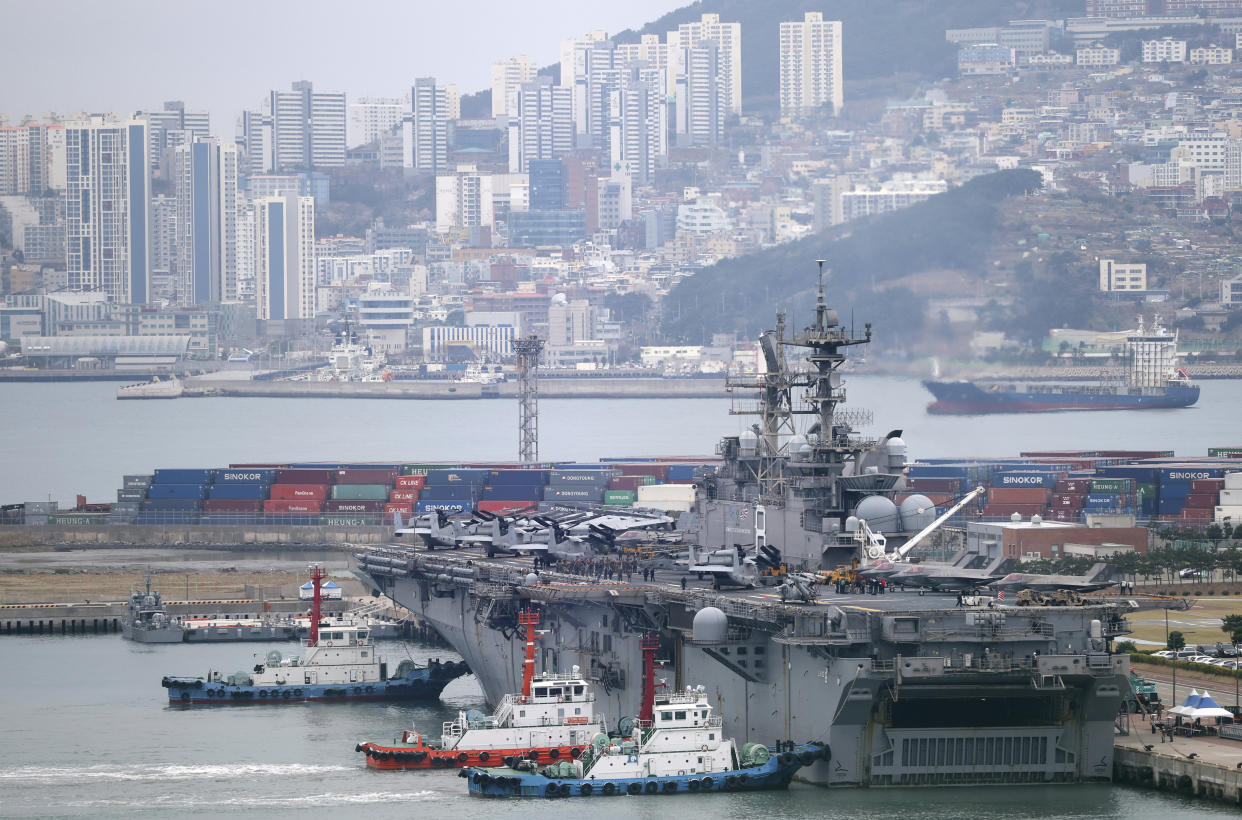 U.S. Navy's the amphibious assault ship USS Makin Island is escorted into Busan port, South Korea, Wednesday, March 22, 2023. North Korea launched multiple cruise missiles toward the sea on Wednesday, South Korea’s military said, three days after the North carried out what it called a simulated nuclear attack on South Korea. (Sohn Hyung-joo/Yonhap via AP)