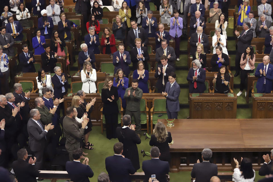 Ukrainian President Volodymyr Zelenskyy receives a standing ovation from Canada's Prime Minister Justin Trudeau and parliamentarians after delivering a speech in the House of Commons on Parliament Hill in Ottawa on Friday, Sept. 22, 2023. (Patrick Doyle/The Canadian Press via AP)