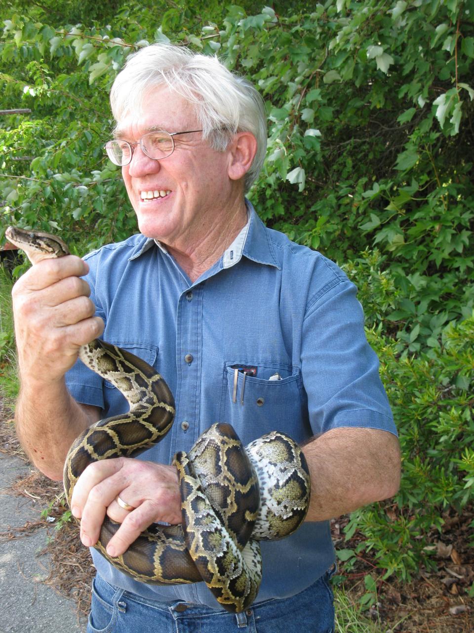Whit Gibbons, a professional herpetologist, is especially fond of snakes. (Photo provided by J.D. Wilson)