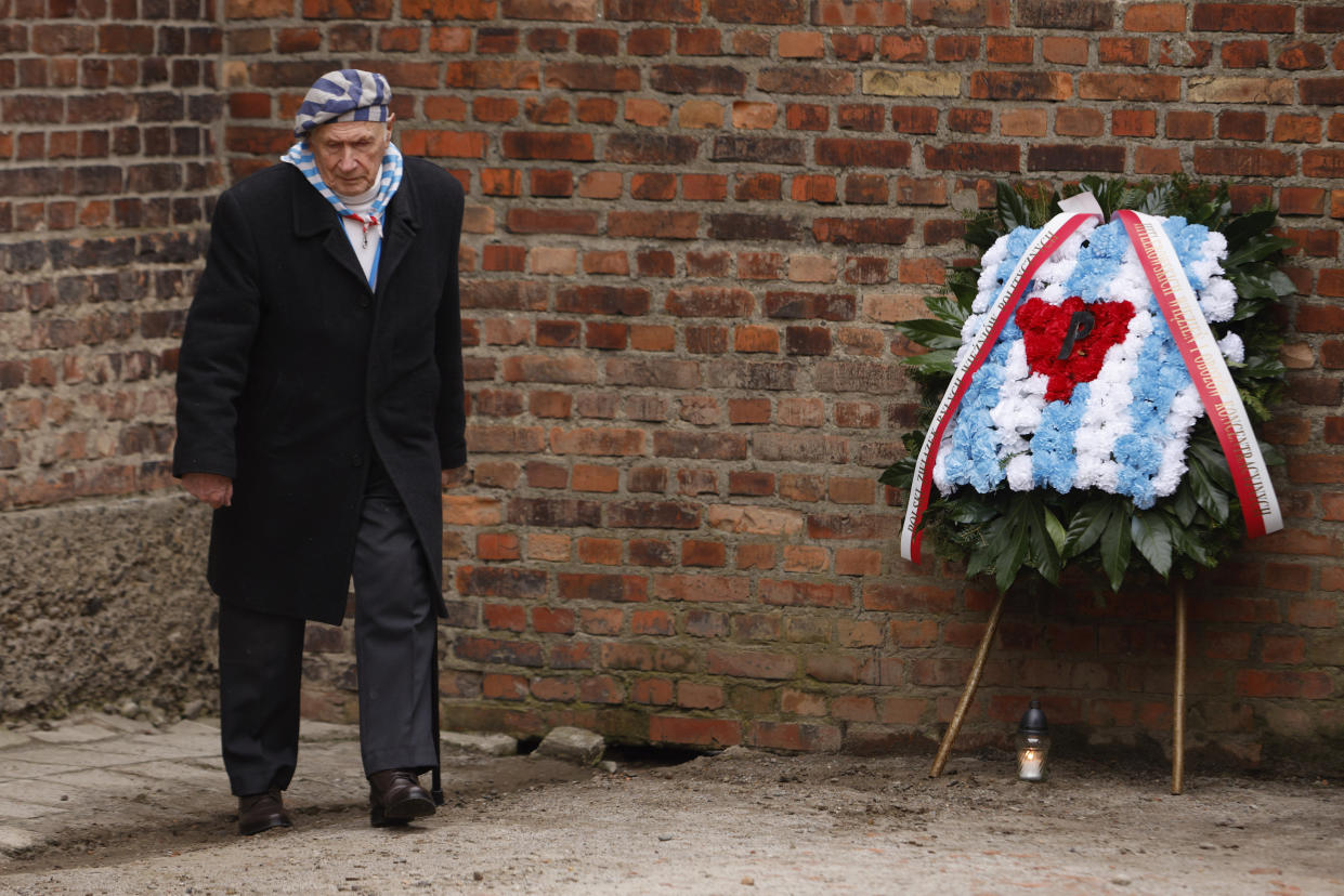 Holocaust survivor, Stanislaw Zalewski, attends a wreath lying ceremony in front of the Death Wall in the former Nazi German concentration and extermination camp Auschwitz during ceremonies marking the 78th anniversary of the liberation of the camp in Oswiecim, Poland, Friday, Jan. 27, 2023. (AP Photo/Michal Dyjuk)