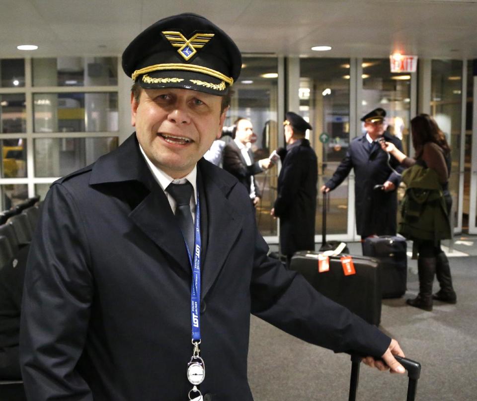 Polish Airlines Captain Stanislaw Radzio talks about the flight of LOT flight 003 from Warsaw, a Boeing 787, after their arrival at Chicago's O'Hare International Airport Wednesday, Jan. 16, 2013. The FAA grounded all Boeing 787 Dreamliner airplanes pending safety checks of the planes lithium batteries and passengers ticketed on the return flight to Warsaw were rebooked on other airlines. (AP Photo/Charles Rex Arbogast)