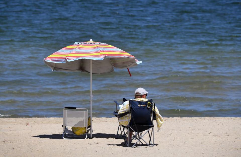 A man enjoys the spring weather on Melbourne's St Kilda Beach.